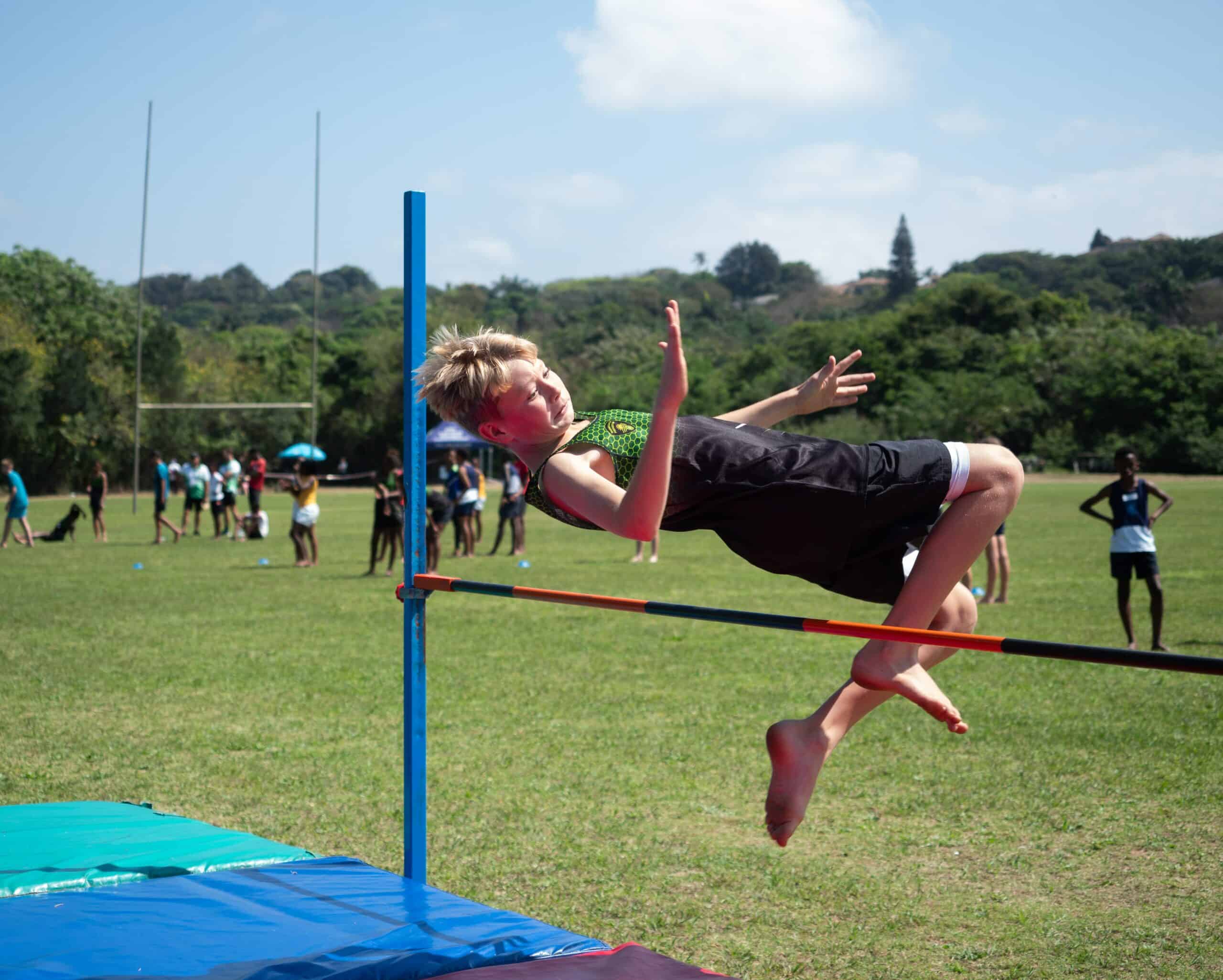A child doing high jump.
