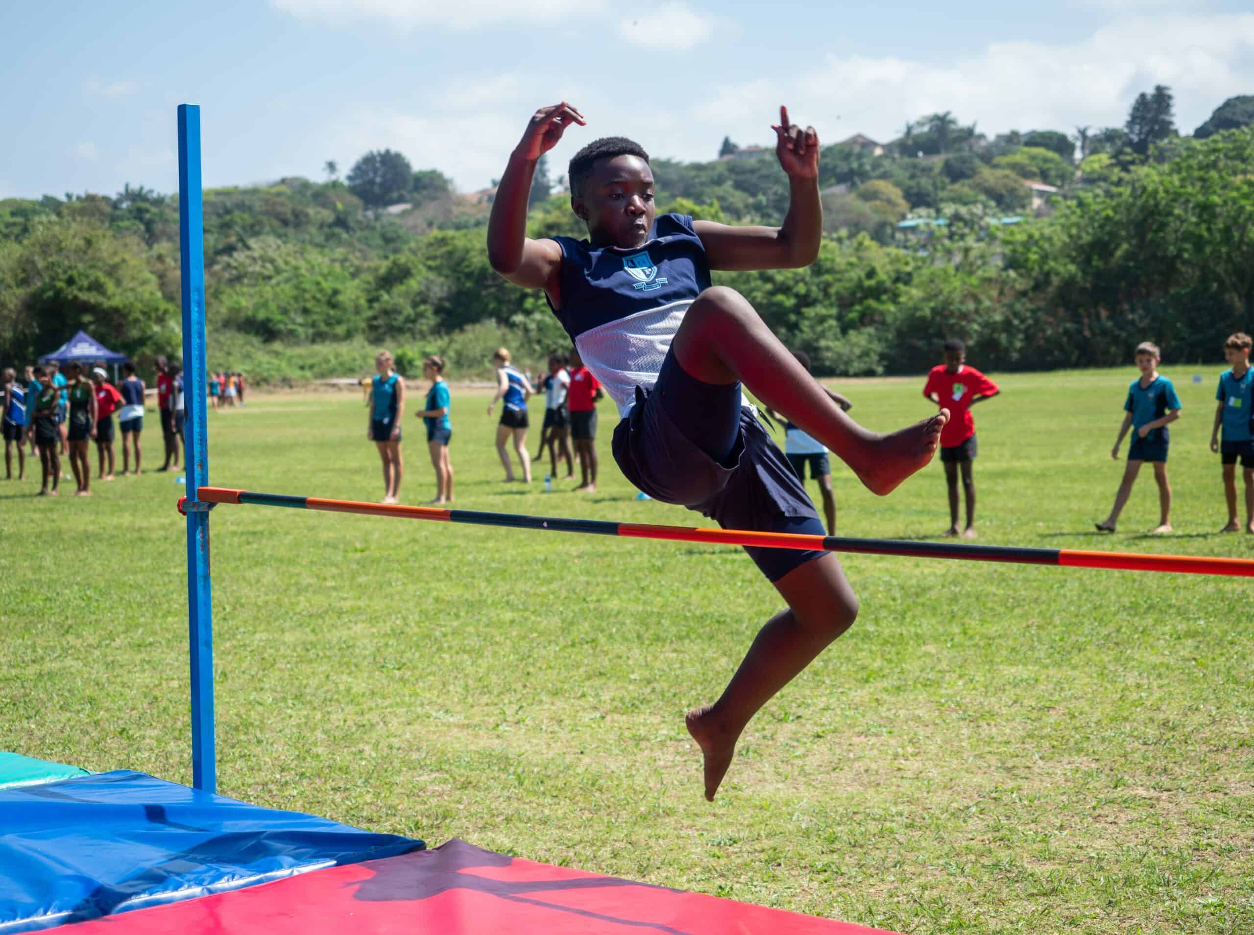 A child doing high jump.