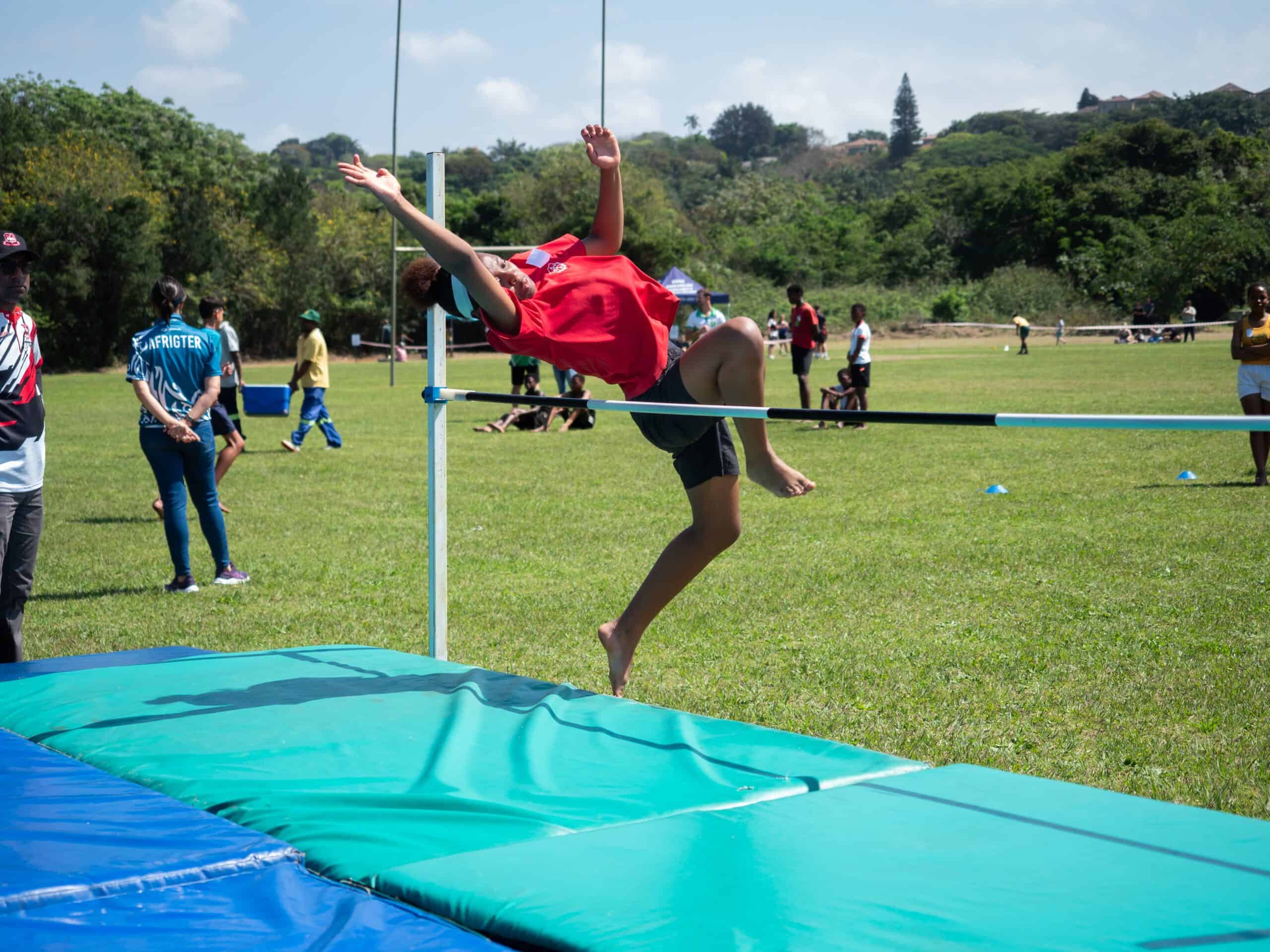 A child doing high jump.