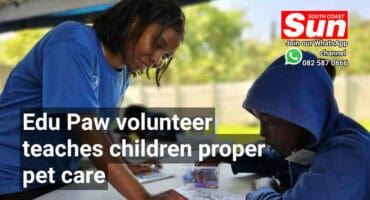 A woman teaching a small child.