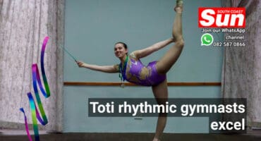 A teenage rhythmic gymnast with a spinning ribbon.