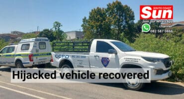 Two vehicles parked along the road.