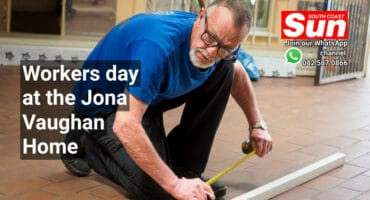 A man measuring trunking for cable management.