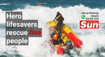 A lifeguard boat sailing out to sea.