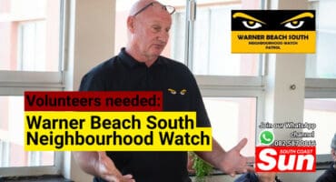 A man speaking to elderly people.