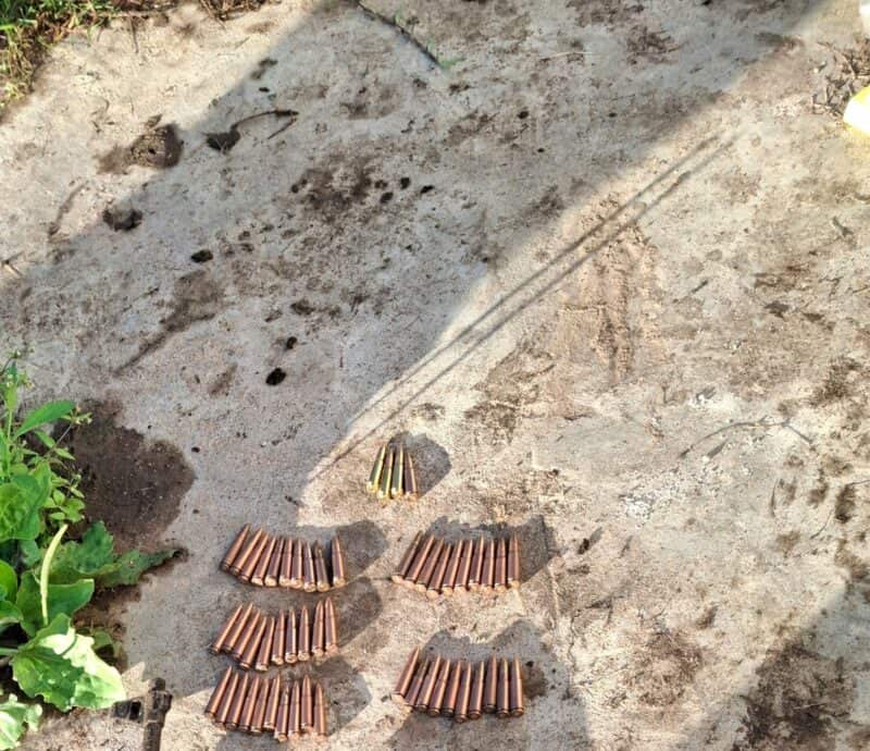 Rifle bullets on the ground.