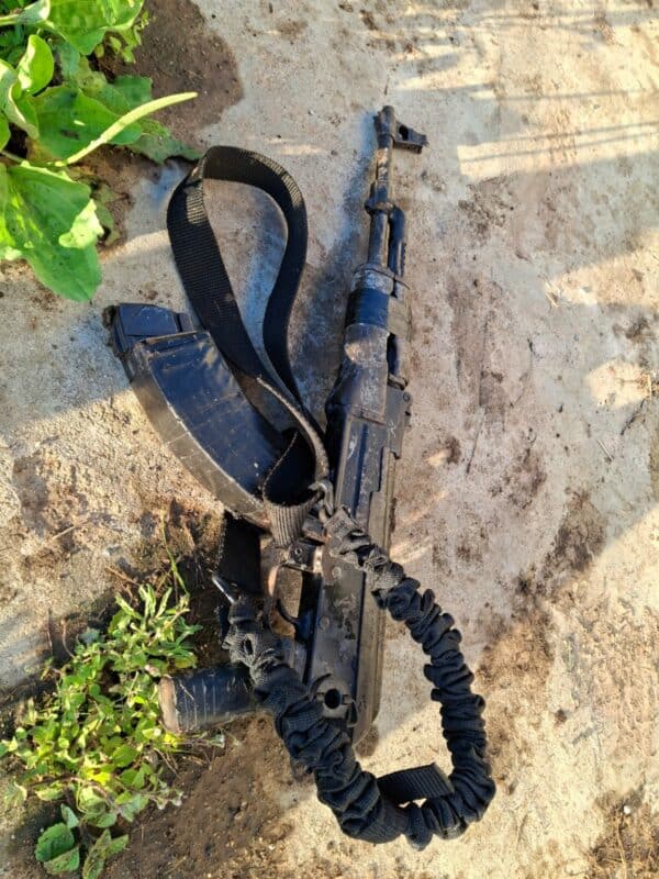 A black AK-47 assault riffle.