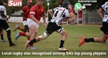 Youth rugby player running with ball in hand