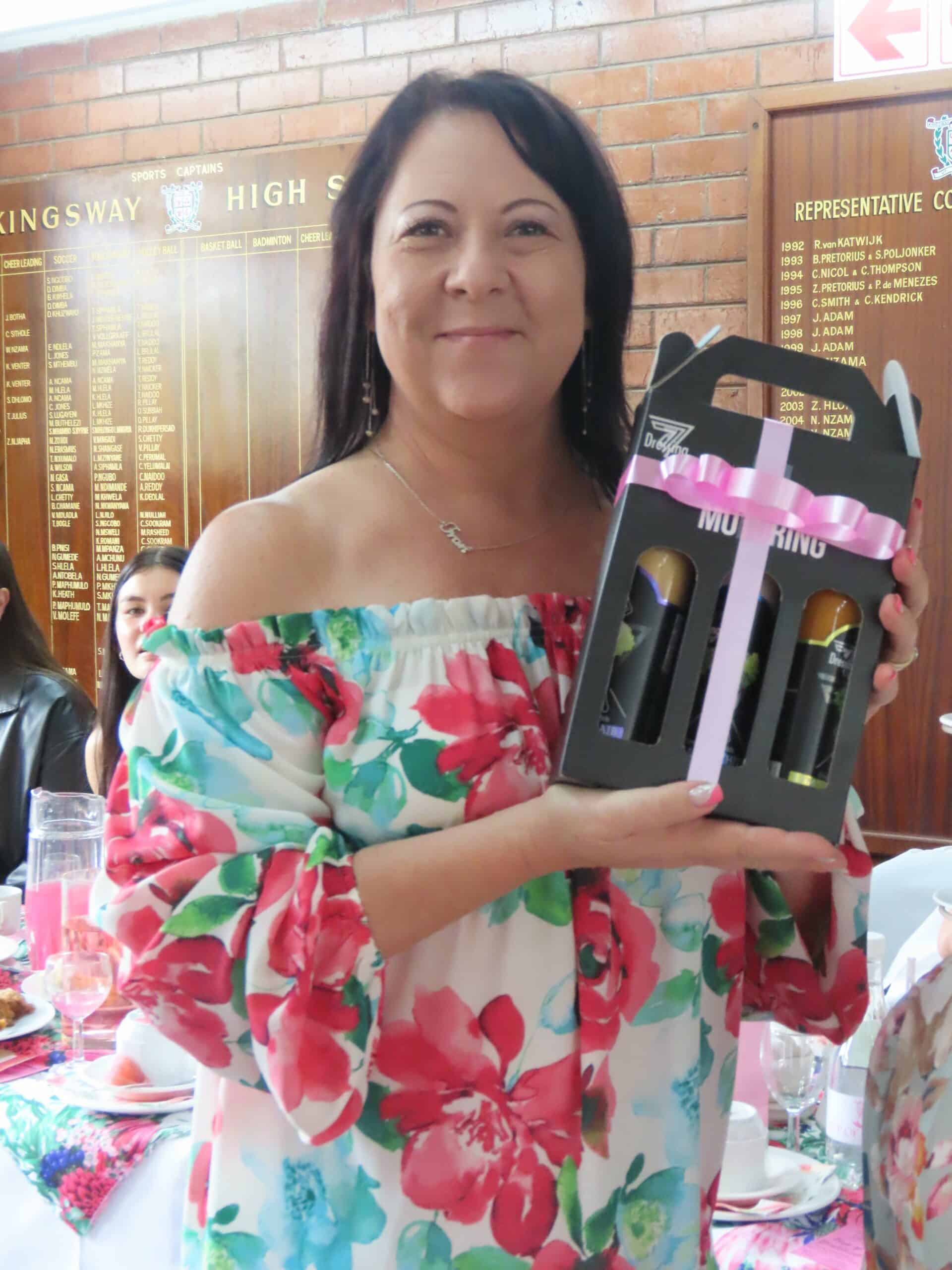 A woman holding her prize