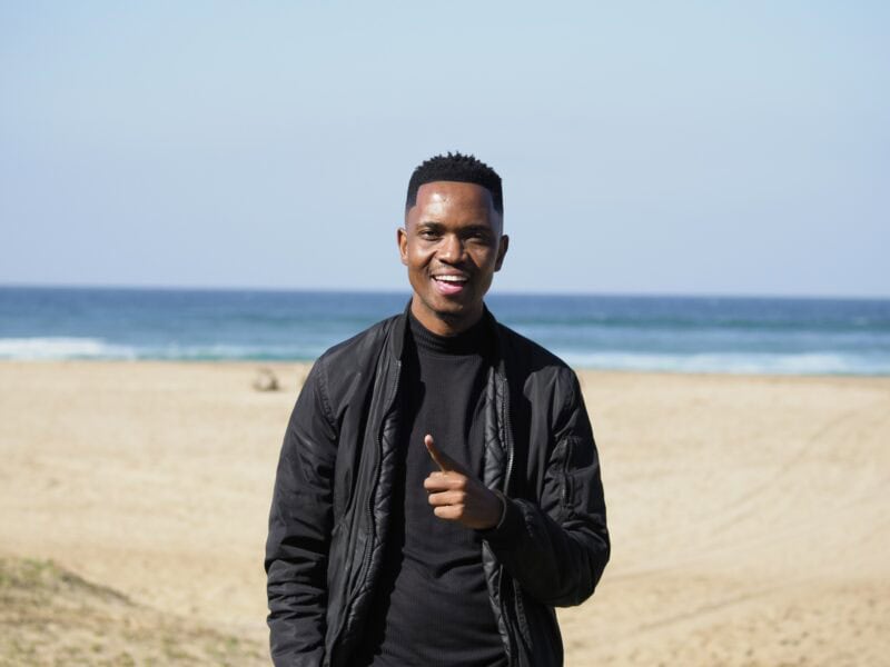 A man standing on the beach.