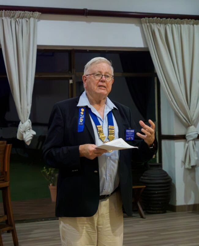 A man talking to an audience.