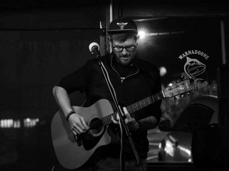 A man playing the guitar.