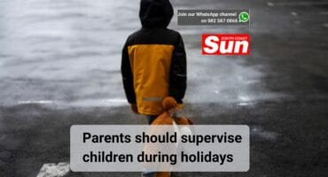 A furlong child holding a teddy bear.