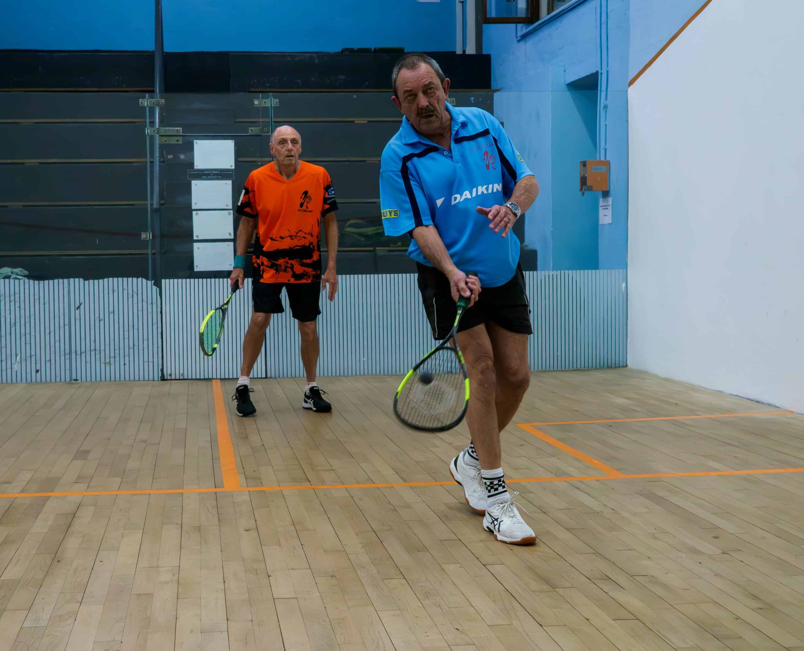Two men playing squash