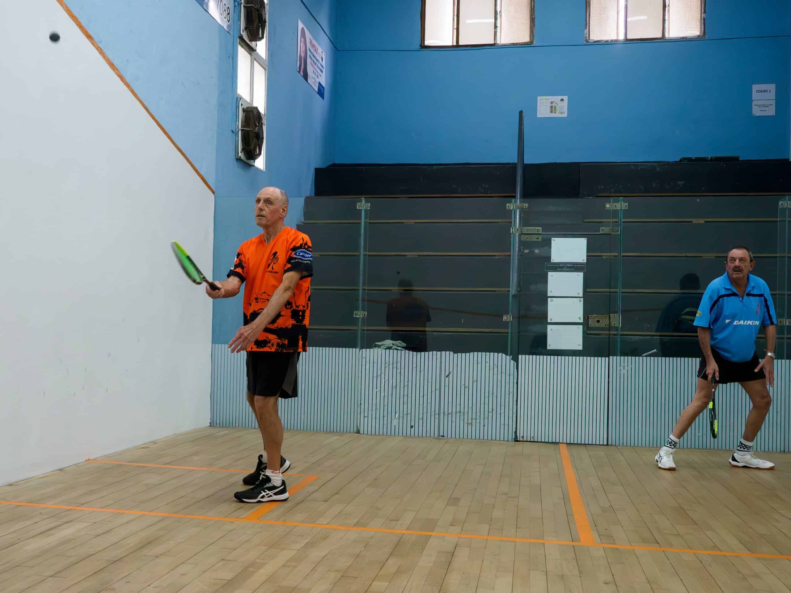 Two men playing squash