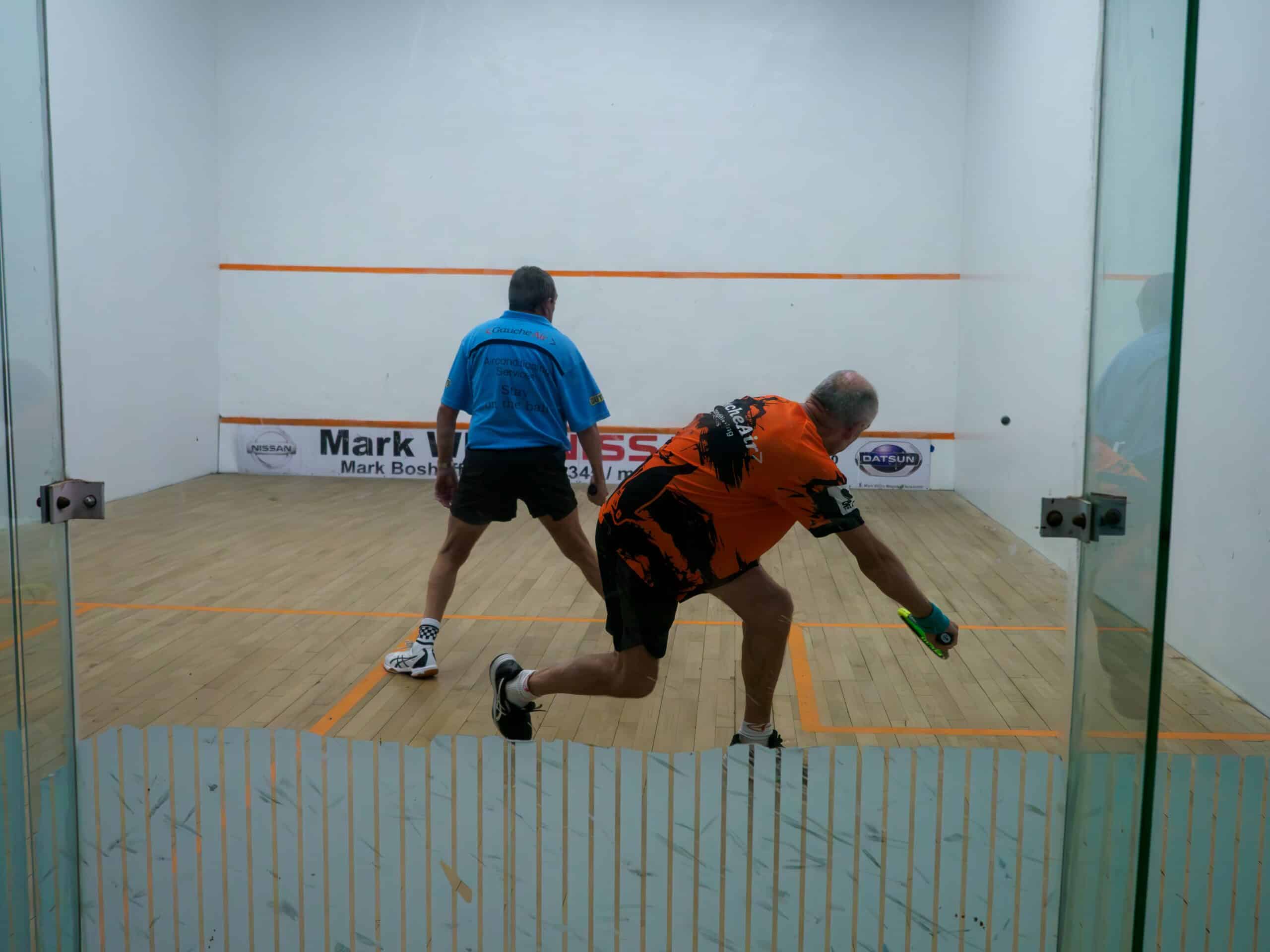 Two men playing squash