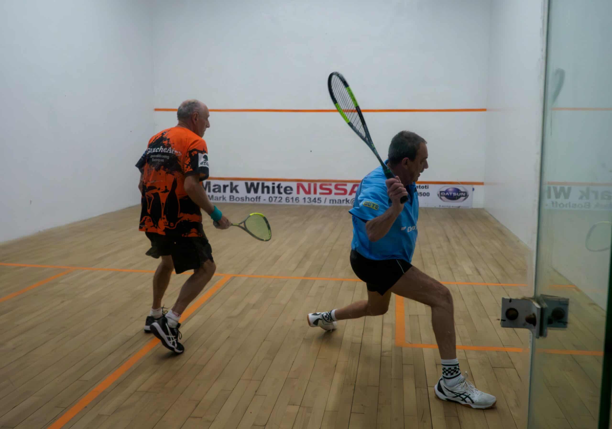Two men playing squash