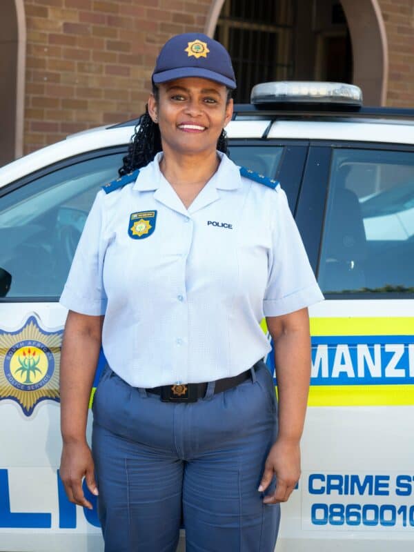 A police officer smiling.