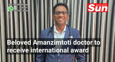 A doctor with a stethoscope around his neck.