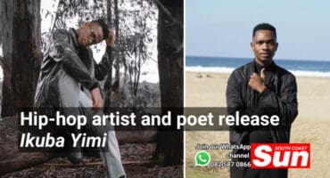 A man sitting on a tree stump and a man standing on the beach.