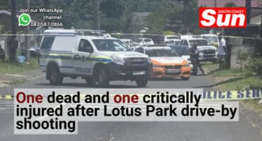 Police vehicles and ambulances in the middle of a crime scene.