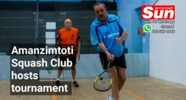 Two men playing squash.