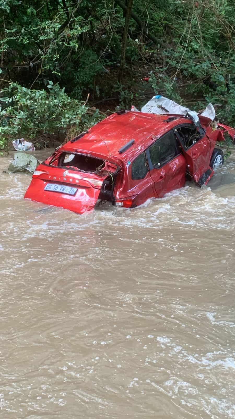 Red car in river