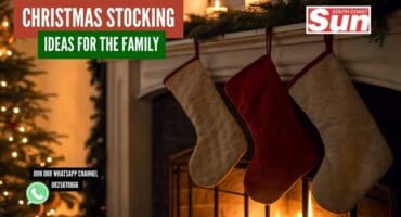Christmas stockings hanging in a house decorated with a Christmas tree.