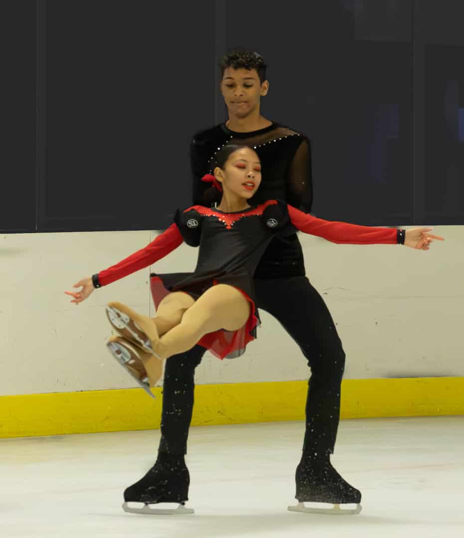 a pair ice skating