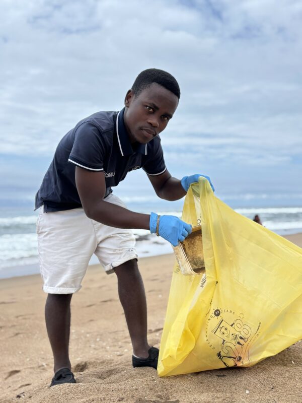 A person cleaning a beach