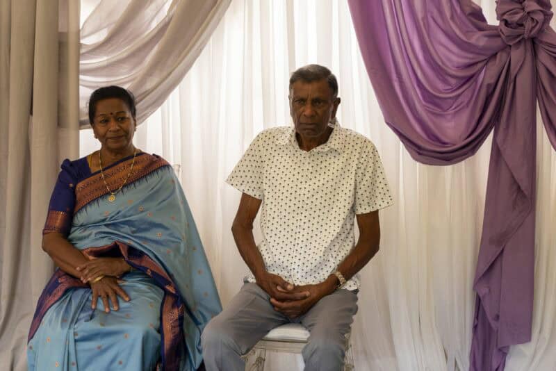 An elderly Indian couple of devotees.