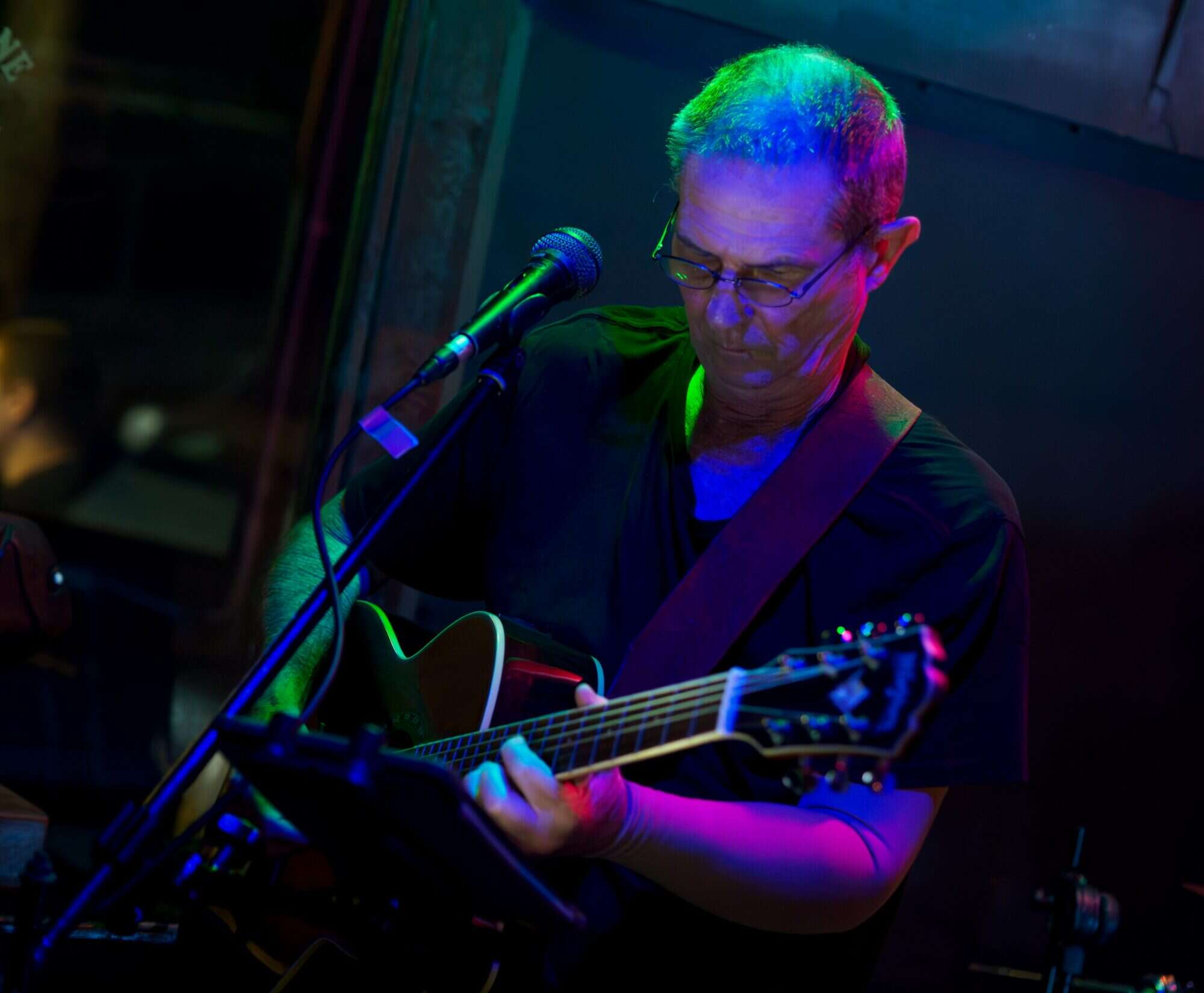 A guitarist performing on stage