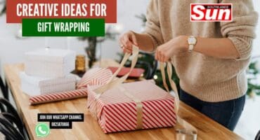 A person wrapping Christmas gifts.