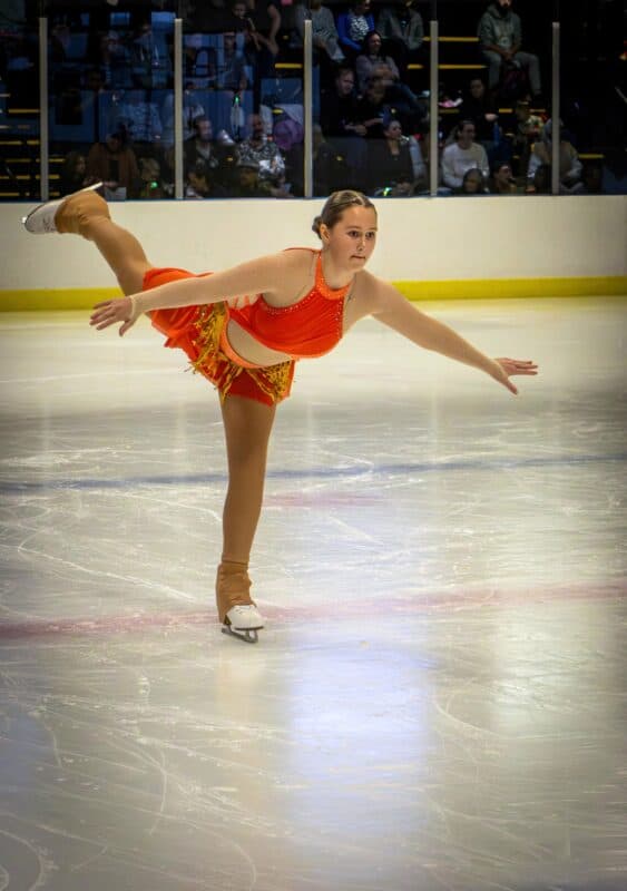 A figure skater performing on the ice.
