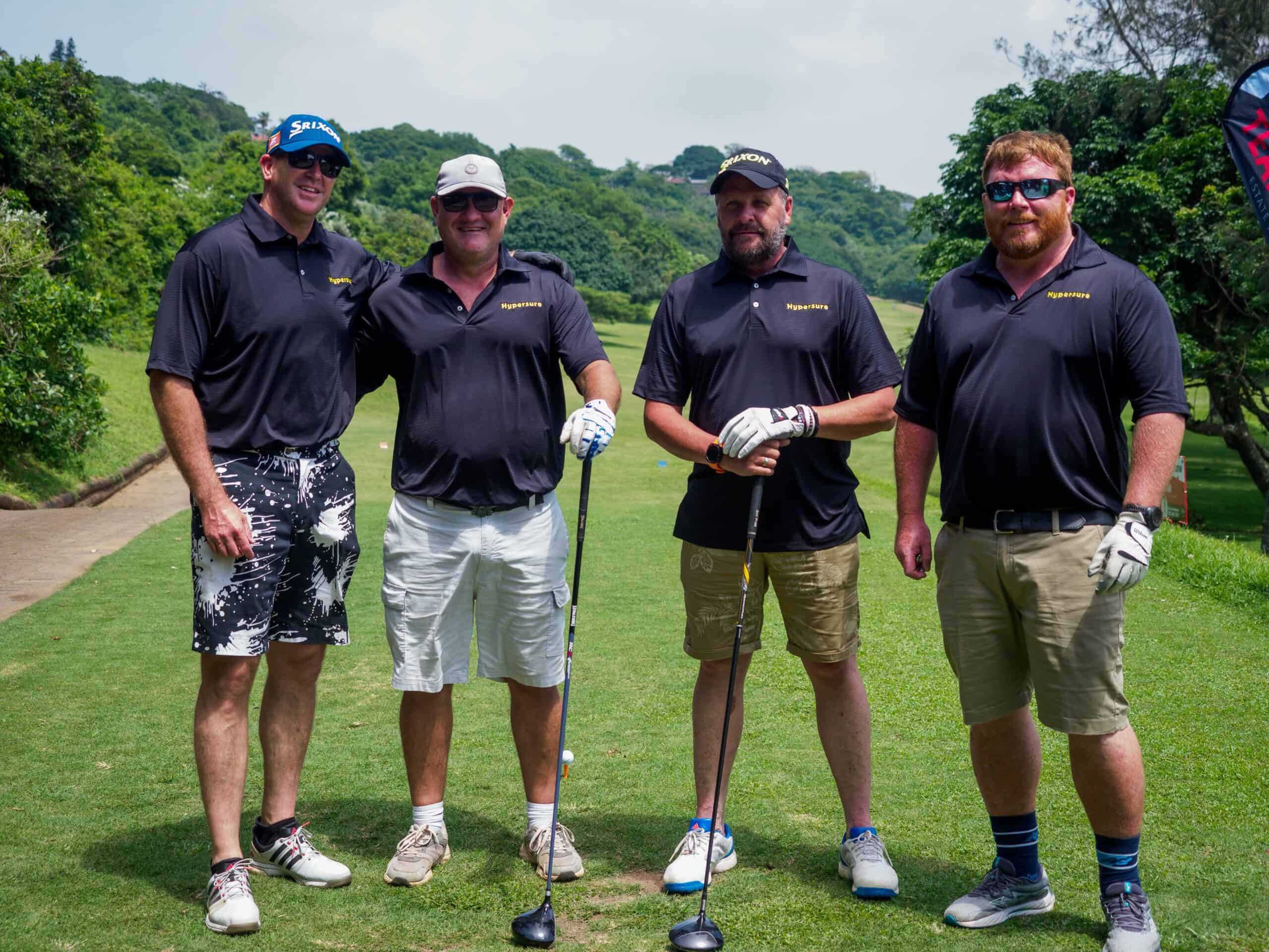 A group photograph at a golf course.