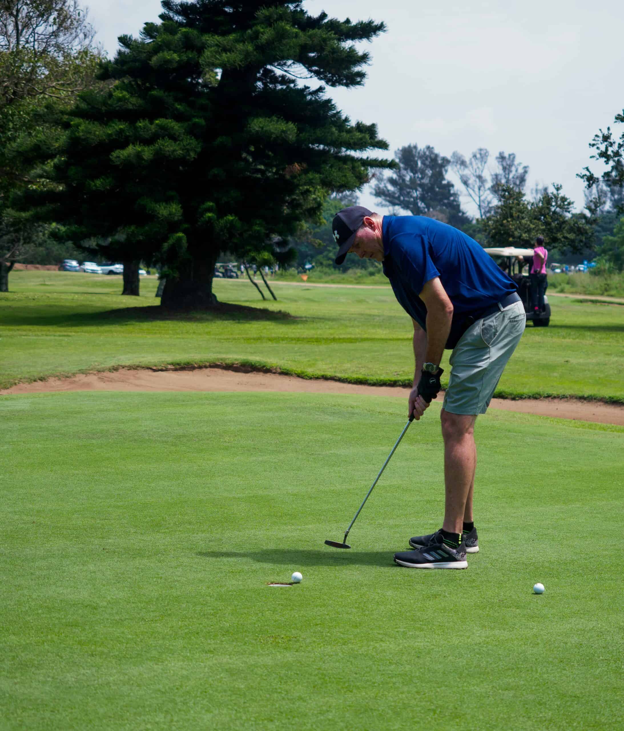 A golfer plays golf.