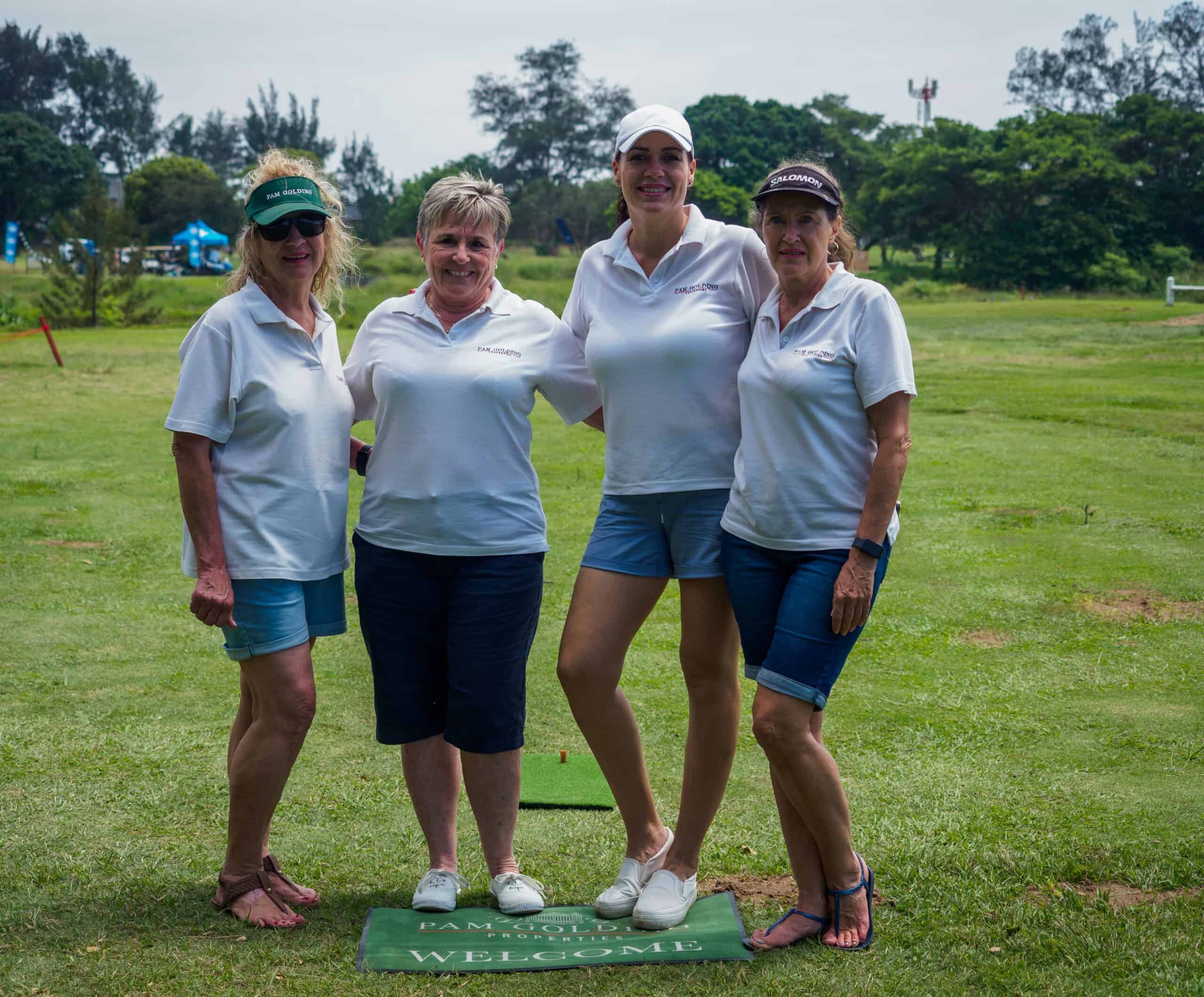 A group photograph at a golf course.
