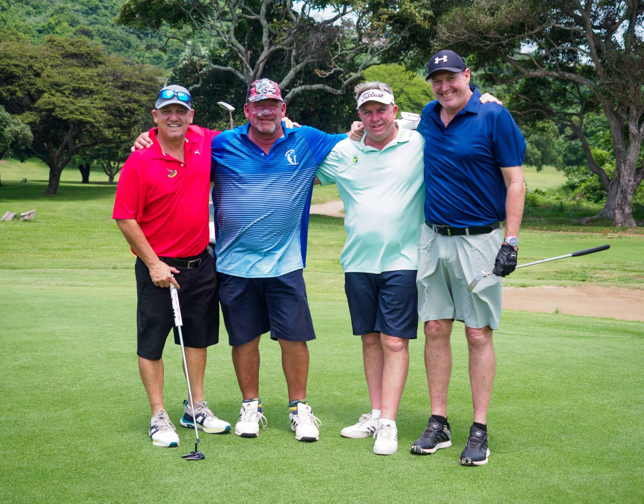 A group photograph at a golf course.