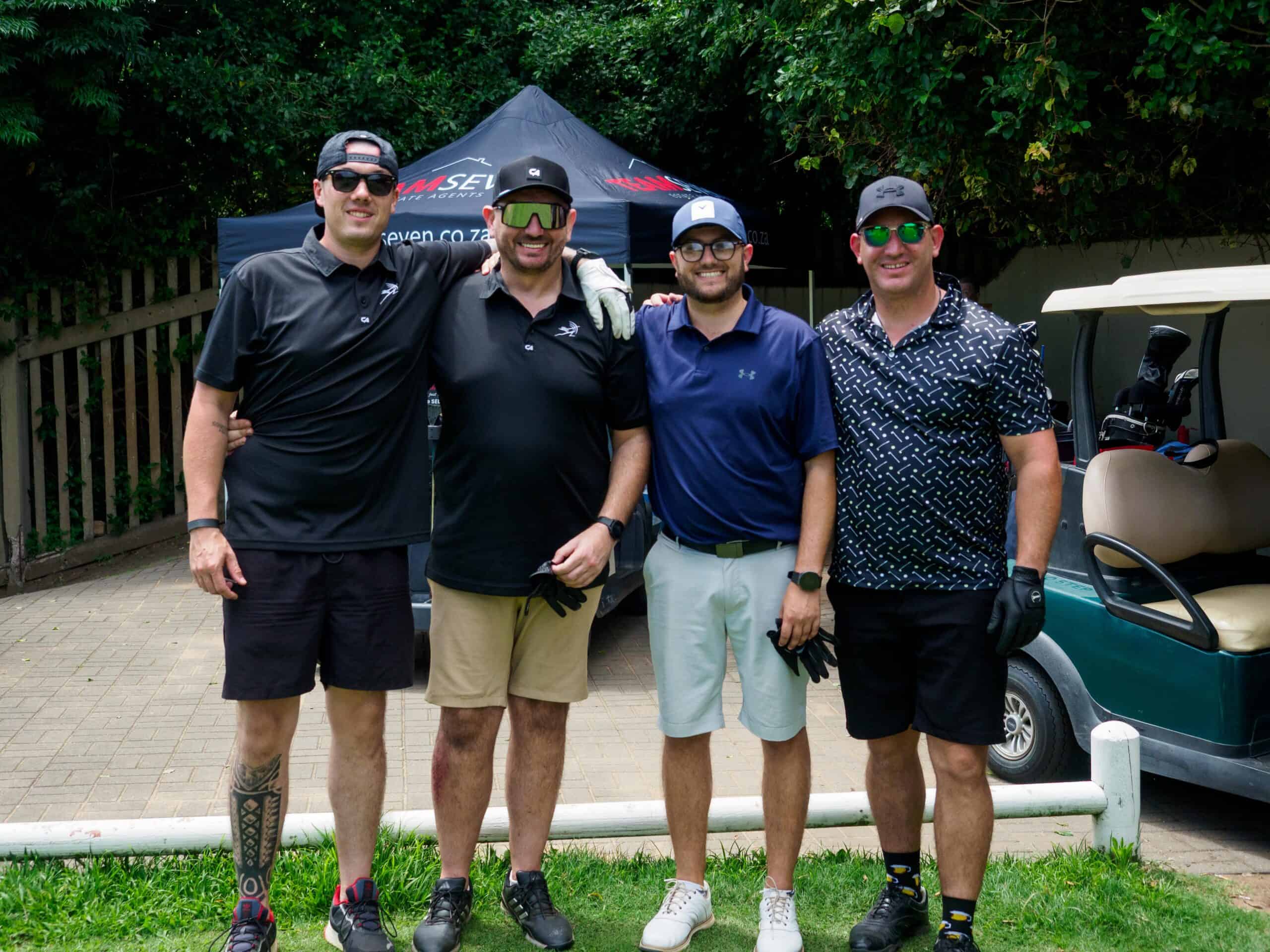 A group photograph at a golf course.