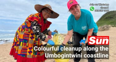 Two women cleaning up at a beach