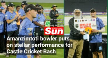 A cricketer getting an award.