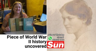 A woman holding three books. A woman.