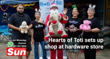 A group photograph including Santa Claus