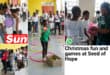 Children playing games like tug of war, hula hoop jump and throw and the balloon balance challenge.