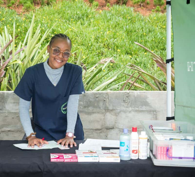 a paravet woman at a mobile vet stand