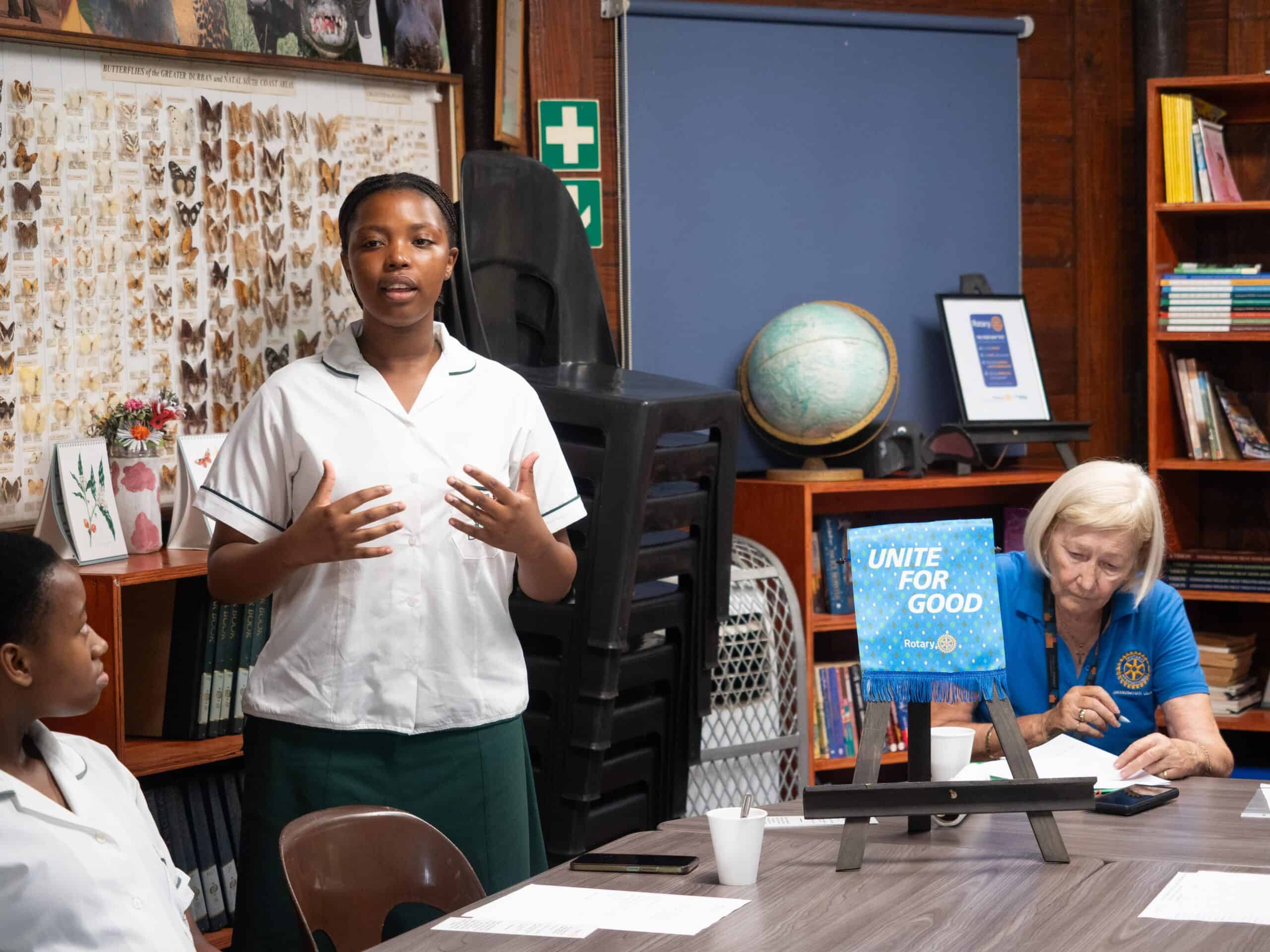 a schoolgirl speaking at a workshop session