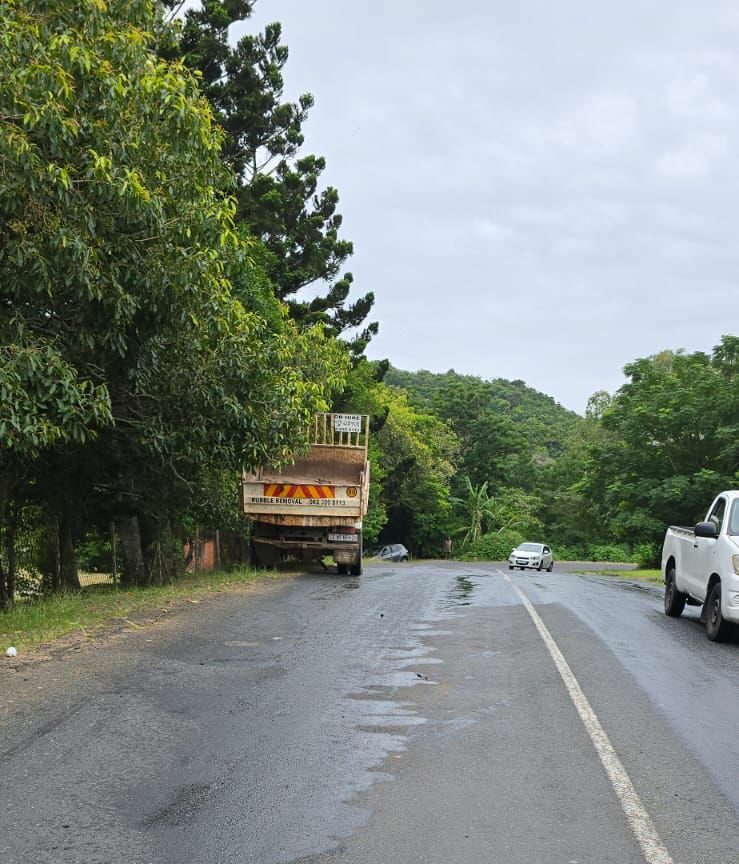 A truck. On the road behind it, diesel spillage. 
