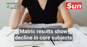 A woman at a desk doing accounting.