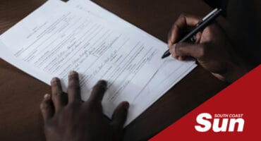 a man signing a document