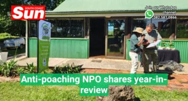 wildlife conservationists talking outside a building